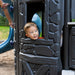 Child peeking through a window in the fort section of the Lifetime Adventure Castle playset.