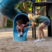 Mother assisting child at the bottom of the slide on the Lifetime Adventure Castle playset.