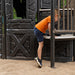 Child stepping into the tower entry of the Lifetime Adventure Castle playset.