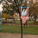 Girl hanging upside down from the swing on Lifetime Adventure Tower playset.