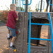 A young boy climbs the rock wall of the Lifetime Adventure Tower playset, with focus on his hands gripping the colorful climbing stones.