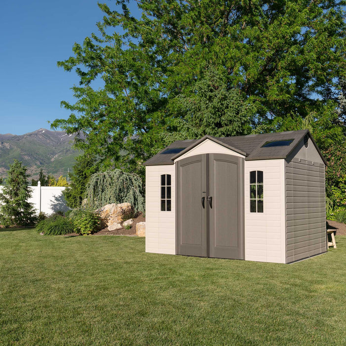 A large Lifetime 10 Ft. X 8 Ft. Outdoor Storage Shed - 60005 in the background.