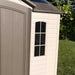 A Lifetime 10 Ft. X 8 Ft. Outdoor Storage Shed - 60005 in a yard with a window.
