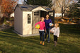 Two girls standing in front of a Lifetime 10 Ft. X 8 Ft. Outdoor Storage Shed - 60178.