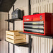A red Lifetime 11 Ft. X 18.5 Ft. Outdoor Storage Shed - 60355 is on a shelf in a shed.