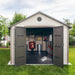 A Lifetime 11 Ft. X 18.5 Ft. Outdoor Storage Shed - 60355 with a door open in the backyard.