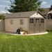A Lifetime 11 Ft. X 18.5 Ft. Outdoor Storage Shed - 60236 in a yard.