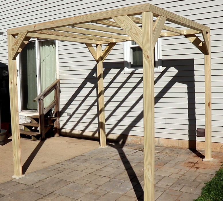 An Amish Gazebos patio pergola louvers - ADD-ON only on a patio in front of a house.