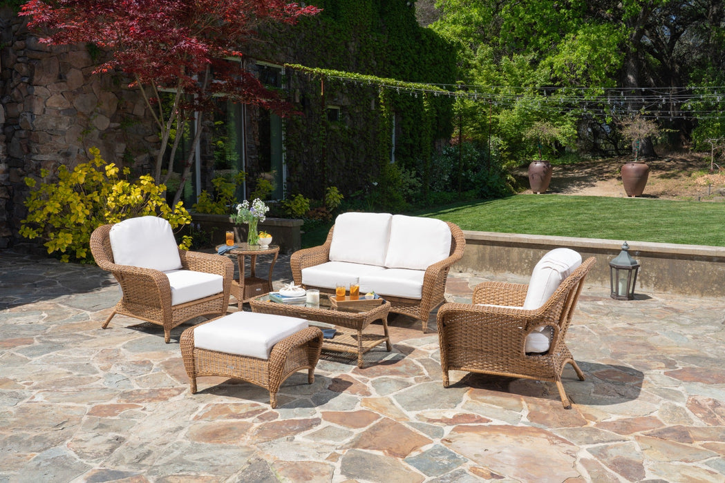 A Tortuga Outdoor Sea Pines 6-Piece Loveseat Set in Mojave with canvas natural cushions.
