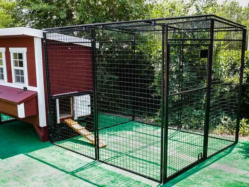 An OverEZ chicken run with 8 ft. durable black mesh for enhanced protection, set against greenery.