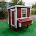  Angled view of OverEZ Chicken Coop with red and white color scheme showing the accessible door, designed to accommodate up to 10 chickens.