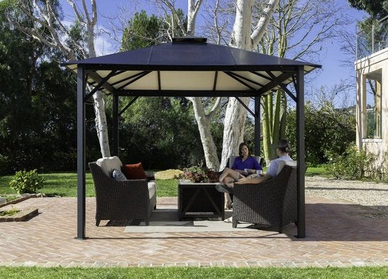 Comfortable outdoor seating under the Durham Gazebo in a serene garden setting, perfect for relaxation.