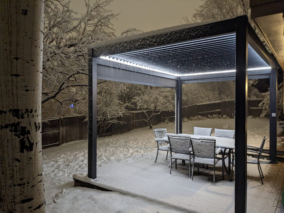 A Bon Pergola Villa Pergola in the snow with table and chairs.