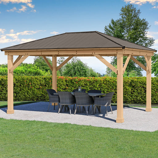 A Yardistry Meridian Premium Gazebo with chairs and a table in the middle of a grassy area.