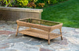 Tortuga Outdoor Sea Pines - Mojave coffee table on a stone patio.