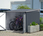 A Duramax 6'x6' anthracite bike shed with white trim, open and neatly storing bicycles next to a residential driveway, illustrating a practical and aesthetically pleasing storage solution.