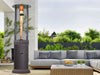 Silver Vein Flame Tower Heater in a garden patio setting.