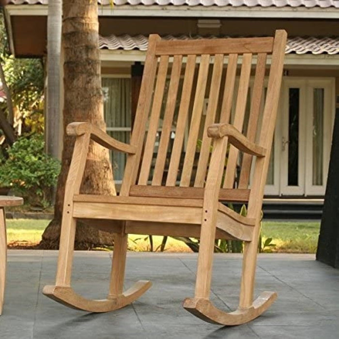 A Tortuga Outdoor Jakarta 3-Piece Wood Rocking Chair Set on a patio, with durable construction.