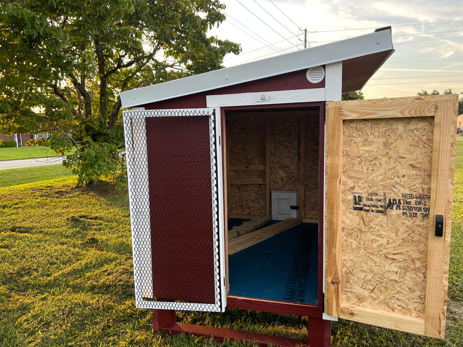  OverEZ Large Chicken Coop's ventilated entry door, providing ample airflow and easy access, a feature of the Flock Bundle Plus.