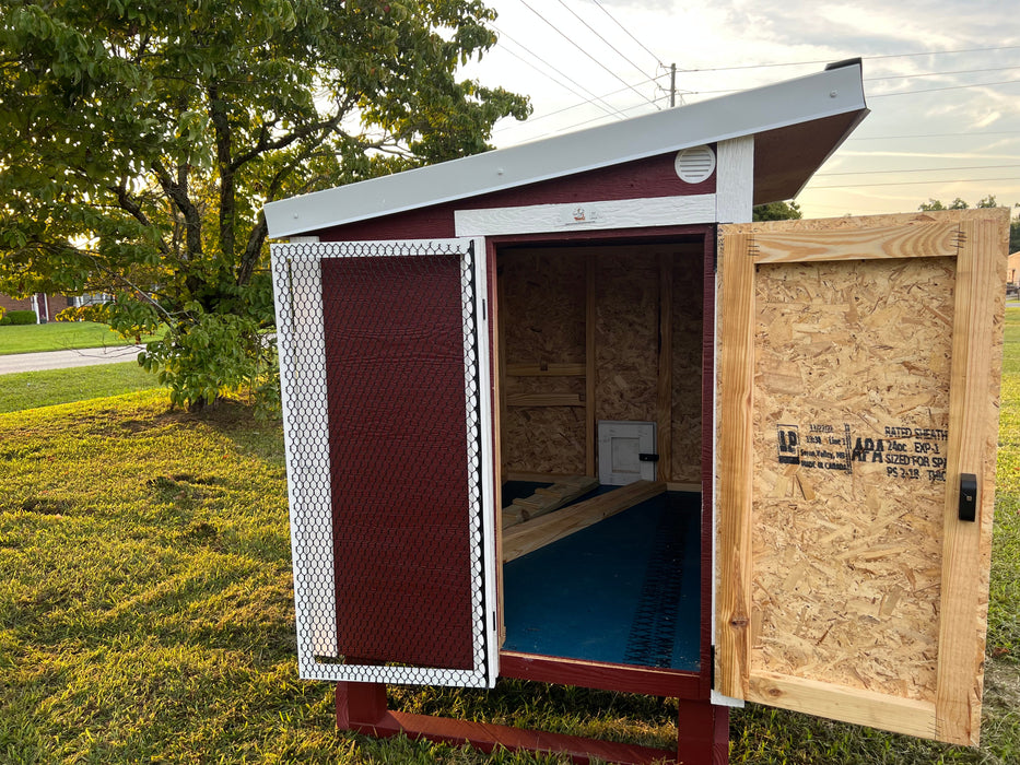 OverEZ Jumbo Chicken Coop's ventilated entry door, providing ample airflow and easy access, a feature of the Flock Bundle Plus.