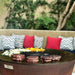 Elegant outdoor dining scene featuring the Arteflame 20 inch grill as a stylish centerpiece.