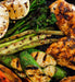 Healthy grilled chicken and vegetables on the Arteflame Classic 40 inch Grill, highlighting nutritious meal options.